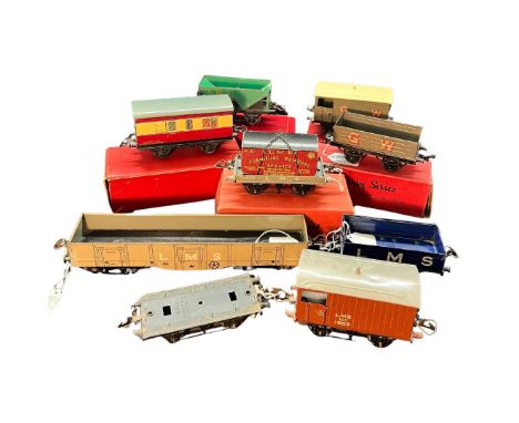 A collection of vintage Hornby O Gauge railway items to include a boxed passenger brake van, a boxed good brake van, a boxed 