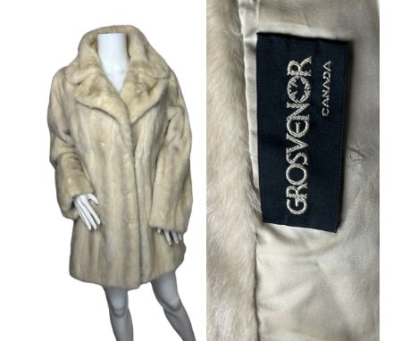 A vintage Azurene mink jacket by Grosvenor Canada with satin lining, self lined collar and three furrier hooks to fasten. M-L
