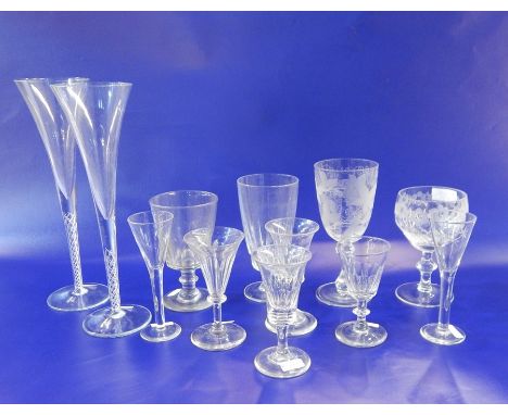 Four late 19th century wines, panelled, on stepped foot, a similar rummer, a cut glass and engraved goblet, two goblets, two 