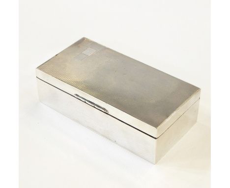 Early 20th century silver rectangular cigarette box of Art Deco design, with engine turned decoration, Sheffield 1934, 18cm d