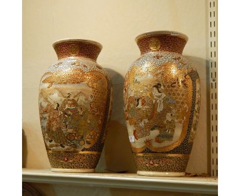 Pair of 19th century Japanese satsuma earthenware vases, each with shaped panels, variously of a lady in interior preparing h