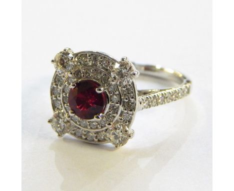 18K white gold, ruby and diamond cluster ring&nbsp;set centre circular facet-cut Burmese ruby with surround of two concentric