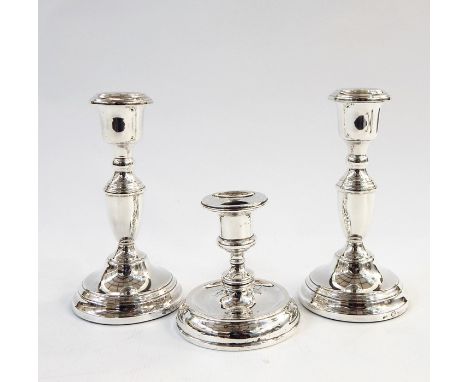Pair of 20th century silver candlesticks, Birmingham 1955, makers 'ESC' and a further weighted candlestick, Birmingham 1925, 