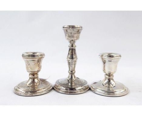 Pair of 20th century silver dumpy candlesticks and a single silver candlestick (3)