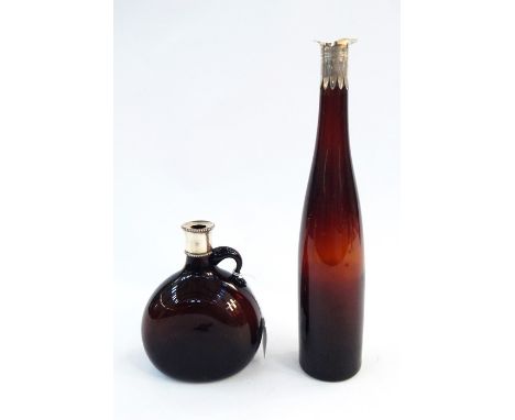 19th century brown glass wine ewer, circa 1853, of bulbous form, 18cm high and a mid 19th century brown glass decanter, 36cm 