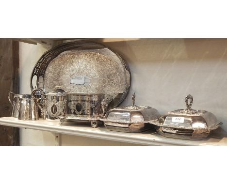 Pair of lidded EPNS serving dishes, an EPNS tea service including biscuit barrel with extravagant foliate decoration, the bis