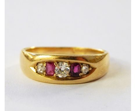 18ct gold, ruby and diamond ring set three diamonds and two pink stones in elliptical setting 