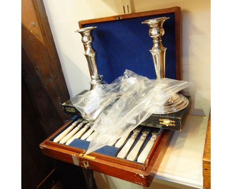 Pair of silver plated candlesticks, six silver plated  soup spoons, an EPNS fish knife and fork with bone handles (boxed) and