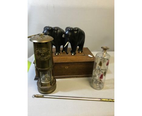 A Collection of odds which includes E. Thomas & Williams minors lamp, Mahogany jewel box, 2 Carved elephants & Antique glass 