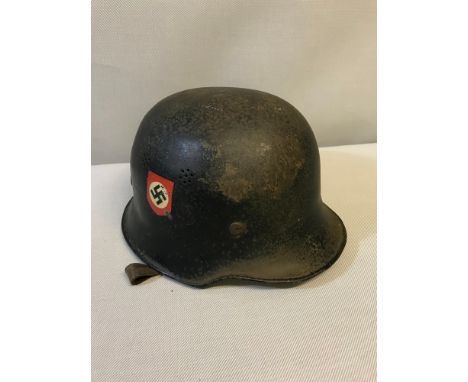 WW2 German police/ fireman helmet with two decals, Swastika & eagle insignia. Original leather liner. 