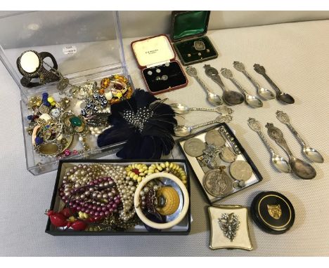 A collection of costume jewellery and collectables which includes EP Coronation spoons, Bronze medal and various coins 