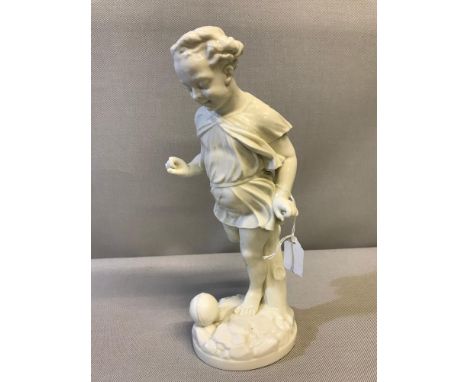 Large old Royal Worcester child playing football figure. Measures 30cm in height 