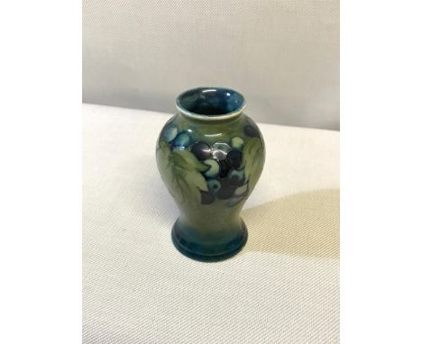 Small Moorcroft vase 'Leaf & Berries' in a green & blue colouring, designed by William Moorcroft, 10cm in height 