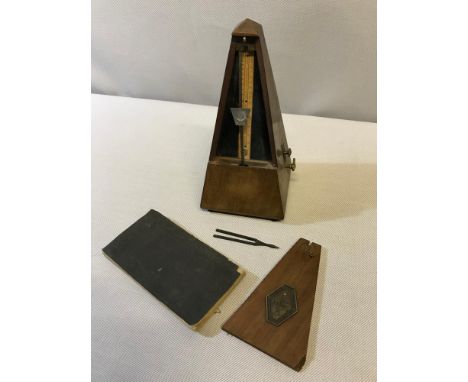A small lot to include; Antique French Maelzel Paquet 1846 metronome, 1858 Scottish Psalmody sheet music booklet and tuning f