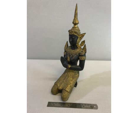 Heavy bronze praying Thai Buddha figurine. Stands 31cm in height. 