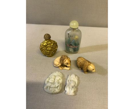 2 Netsuke figures, 2 Hardstone carved pendants &  2 oriental perfume bottles 