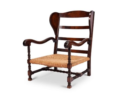 A large Swedish Gripsholm style beechwood open armchair&nbsp;
With ladder back, shaped sides and moulded scroll arms, above a