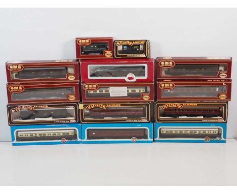 A group of OO gauge rolling stock by AIRFIX and MAINLINE comprising wagons and passenger coaches - VG in G/VG boxes (14)