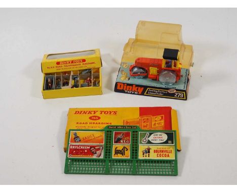 A group of DINKY models and accessories comprising a 279 Diesel Roller in bubble pack, a 765 Road Hoarding Set (replacement r