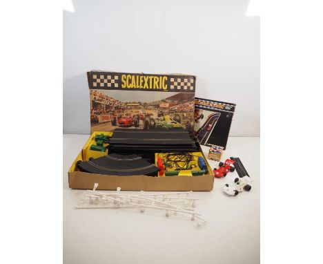 A vintage SCALEXTRIC set, appears complete, together with a pair of unboxed cars and some accessories - F/G in F/G boxes wher