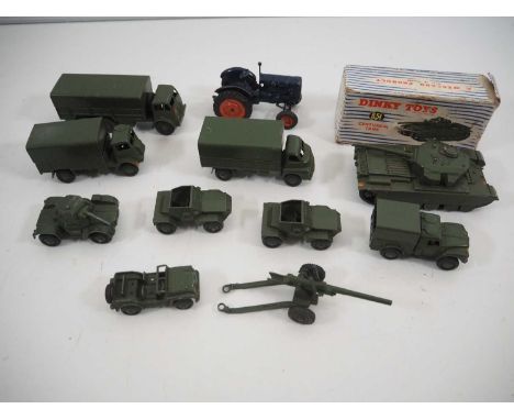 A group of boxed and unboxed DINKY military vehicles in varying conditions, together with a BRITAINS Fordson Tractor - F/G in