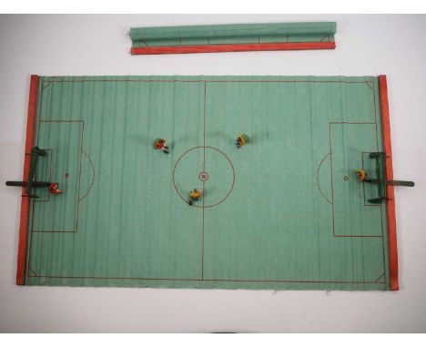 A pre-war football game by unknown manufacturer comprising cast lead players, a roll out cloth field and wire mesh goal posts