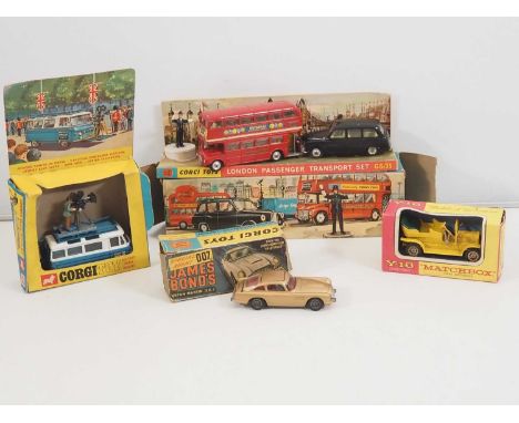 A group of CORGI diecast cars and sets comprising a 261 James Bond Aston Martin, a 479 Commer Camera van and a Gift Set 35 'L