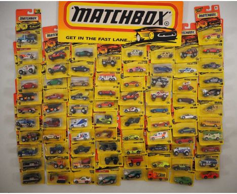 A large quantity of MATCHBOX USA (Tyco) diecast vehicles all sealed on original cards mostly from the 'Action System' series 