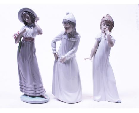 A group of three Nao figures