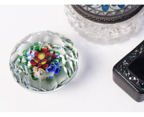 A faceted millefori glass paper weight, a lidded jar and a snuff box