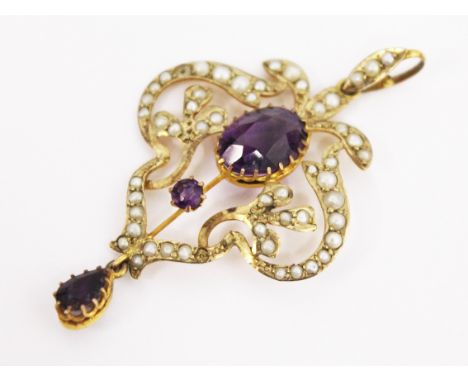 An Edwardian 9ct gold amethyst and seed pearl pendant. L5cm