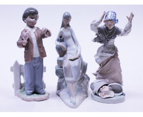 A group of three Nao figures