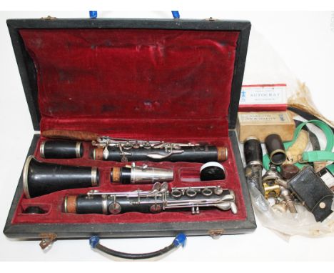 A Boosey and Hawks clarinet together with various brass instrument mouth pieces