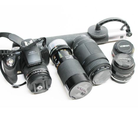 A Fujifilm camera and various lenses