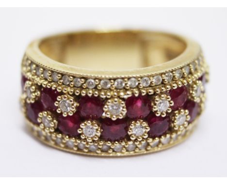 A 14k gold diamond and ruby ring. Gross wt.8.4g. Size N