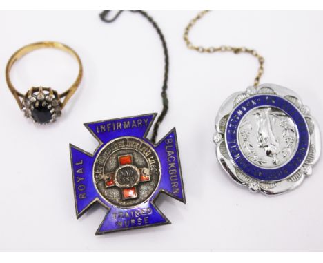 A mixed lot comprising a 9ct gold ring, a silver and enamel nurses badge and another