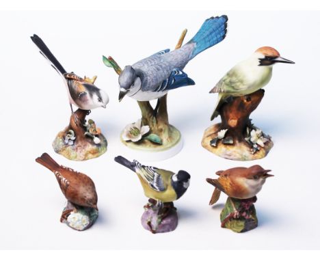 A group pf six bird ornaments comprising three Royal Worcester, two Royal Crown Derby and a crown Staffordshire