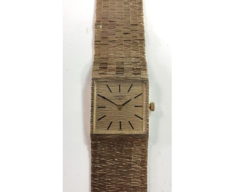Longines - A gentleman's 9ct gold wristwatch, circa 1973, the signed square champagne dial, 23mm, with black batons and hands