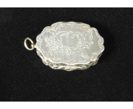 A Victorian silver vinaigrette, by William Dudley, Birmingham 1851, of oval scalloped form decorated with engine turned desig