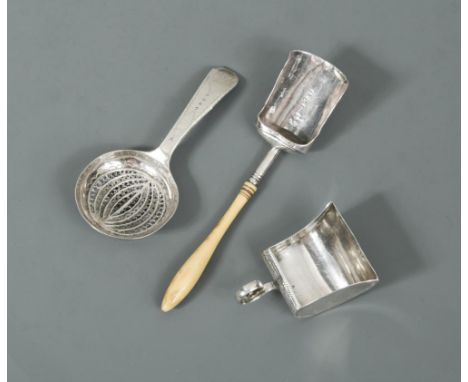 A collection of three George III silver caddy spoons, the first by Samuel Pemberton, Birmingham 1808, shovel shaped with turn