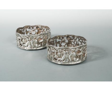 Dublin - A pair of George lll silver wine coasters, possibly by Christopher Clarke, circa 1770, (marked near the lower rim wi