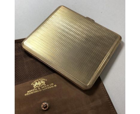 Mappin &amp; Webb - A 9ct gold pocket cigarette case, rectangular in form and heavily decorated all over with wave pattern en