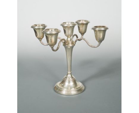 A 20th century silver metamorphic candelabrum, sponsor mark indistinct, possibly Elkington &amp; Co, Birmingham 1966, the pla