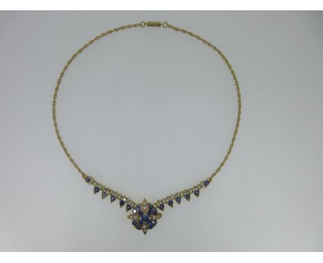 Susan Wright - an 18ct gold handmade sapphire and diamond necklace, the front of the necklace with a line of drop shaped link