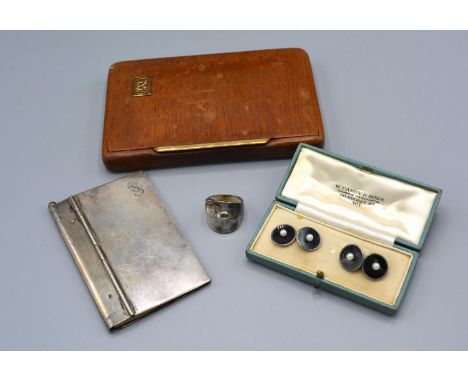 A 9ct Gold Mounted Cigarette Case together with a 900 silver note book, a pair of silver and enamel cufflinks and a silver ri