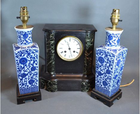 A Victorian Black Slate Mantle Clock together with a pair of Chinese underglaze blue decorated table lamps 