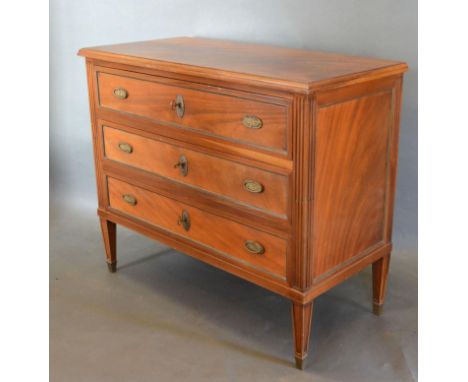 An Early 20th Century French Commode, the moulded top above three drawers with oval drop handles and escutcheons opposed by r