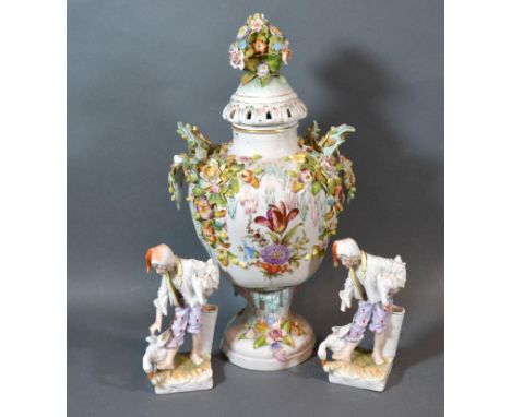 A Sitzendorf Porcelain Covered Vase encrusted with flowers and foliage and with painted decoration 31 cms tall together with 