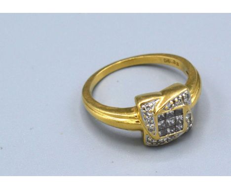 An 18ct. Gold Diamond Cluster Ring of Square Form with a central diamond surrounded by diamonds, 4.6 gms. ring size M 