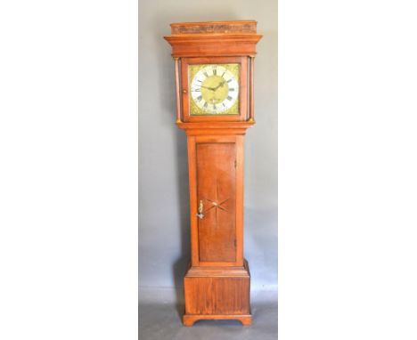 A George III Long Case Clock, the square hood with turned pilasters above a star inlaid door raised upon bracket feet, the si